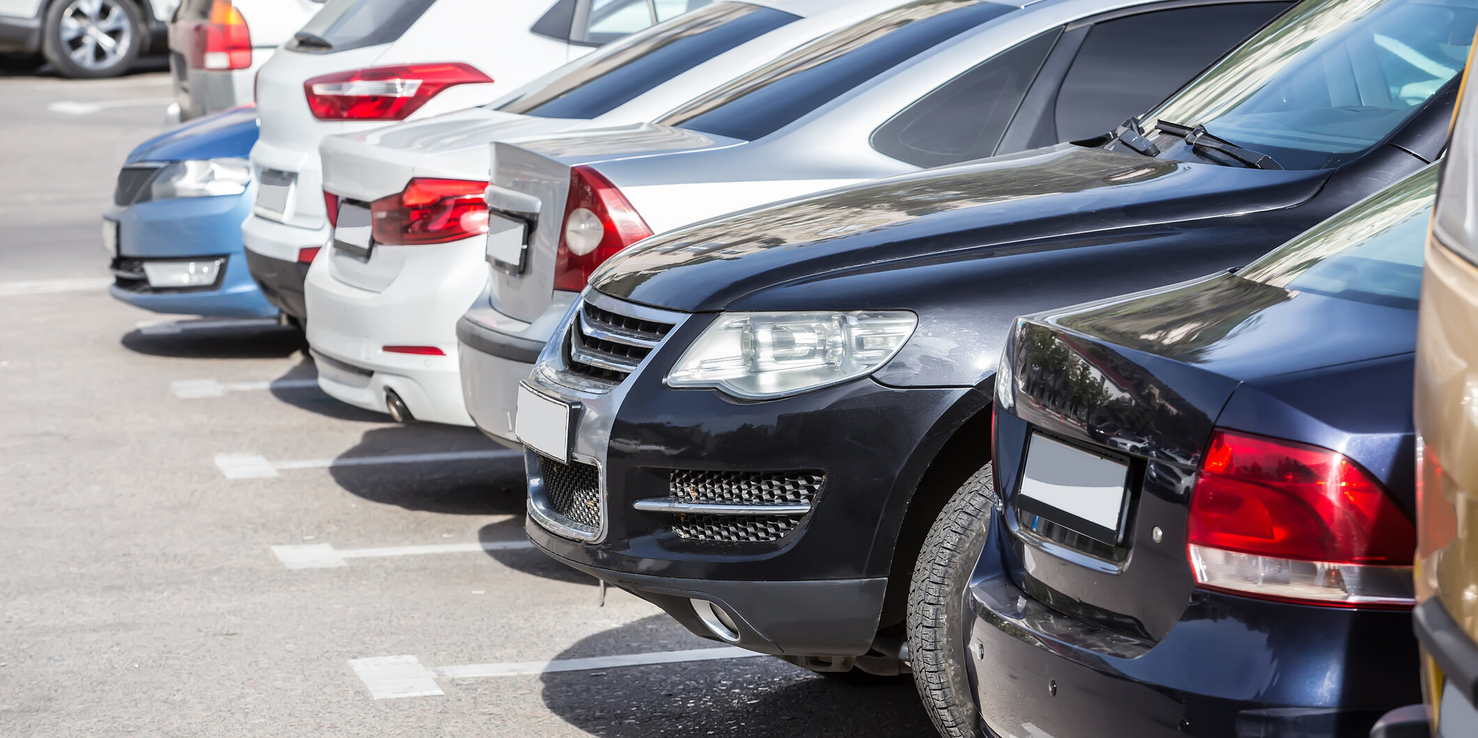 Cars lined up in a parking lot