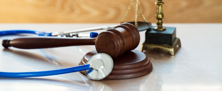 Stethoscope with a legal gavel