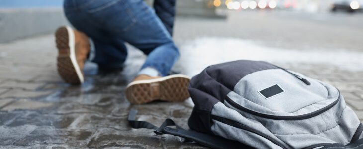 Man fallen on slippery icy sidewalk