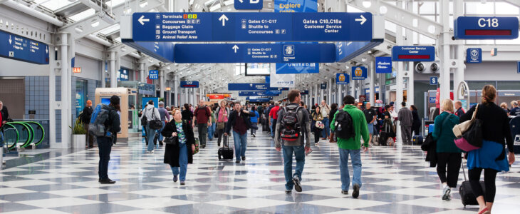 Passengers walking through Chicago O'Hare International Airport